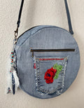 Upcycled denim jeans boho Round Crossbody bag with zipper and pockets.