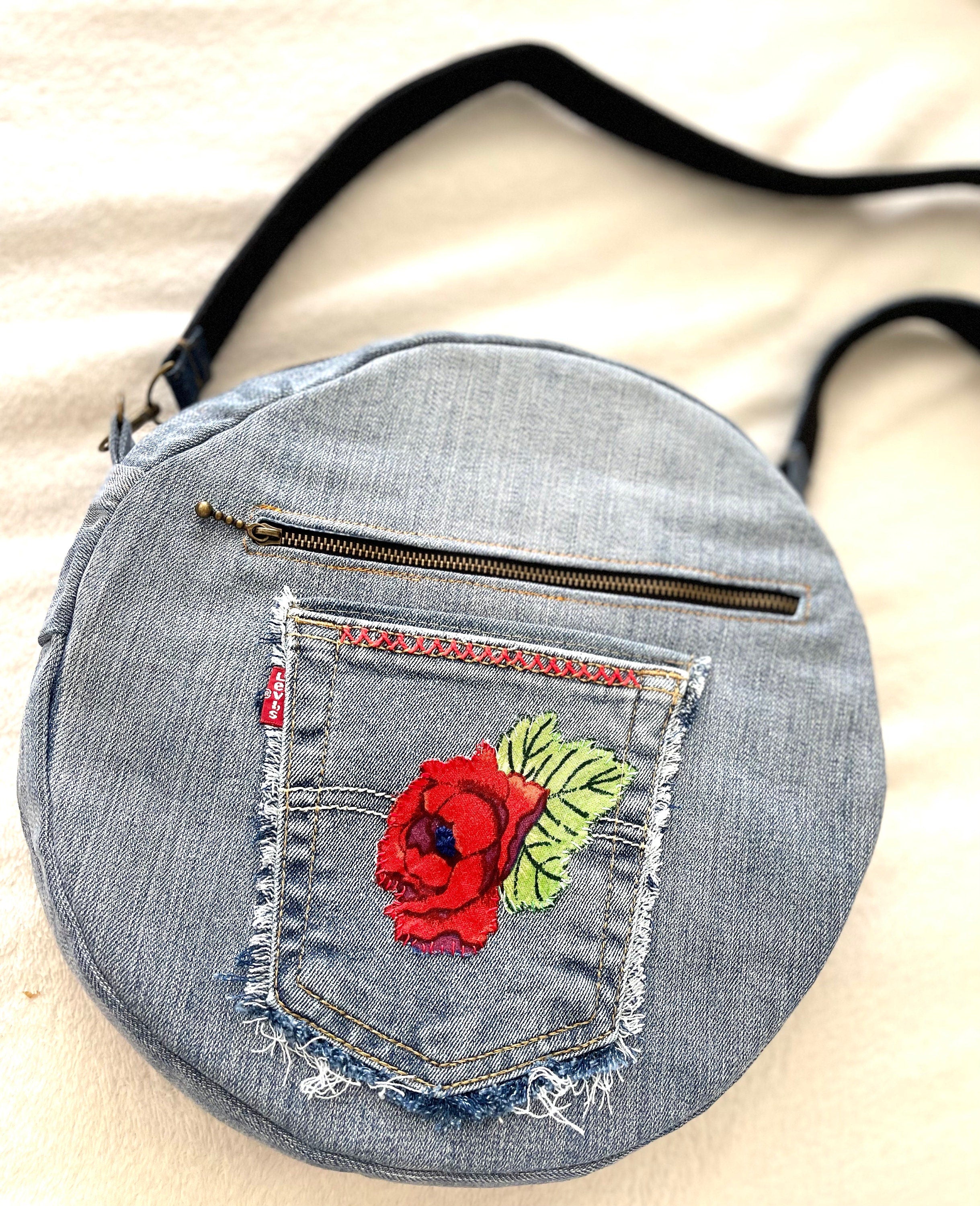 Upcycled denim jeans boho Round Crossbody bag with zipper and pockets.